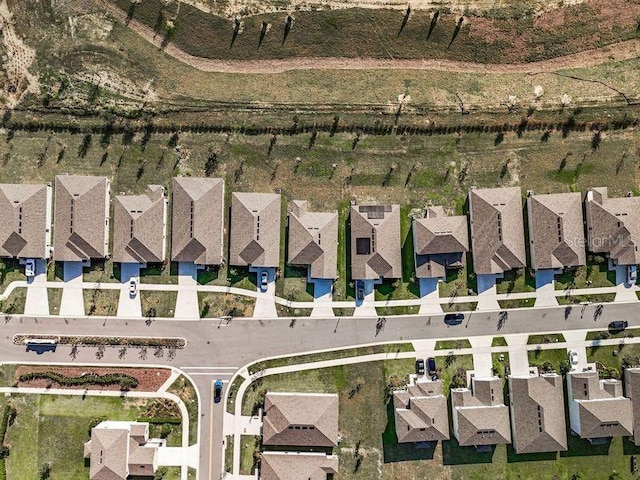 birds eye view of property with a rural view