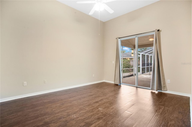 spare room featuring ceiling fan and dark hardwood / wood-style flooring