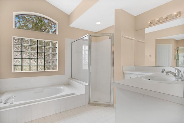 bathroom featuring vanity, shower with separate bathtub, tile patterned floors, and a wealth of natural light