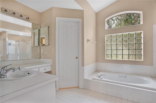 bathroom featuring vanity, plus walk in shower, lofted ceiling, and tile patterned floors