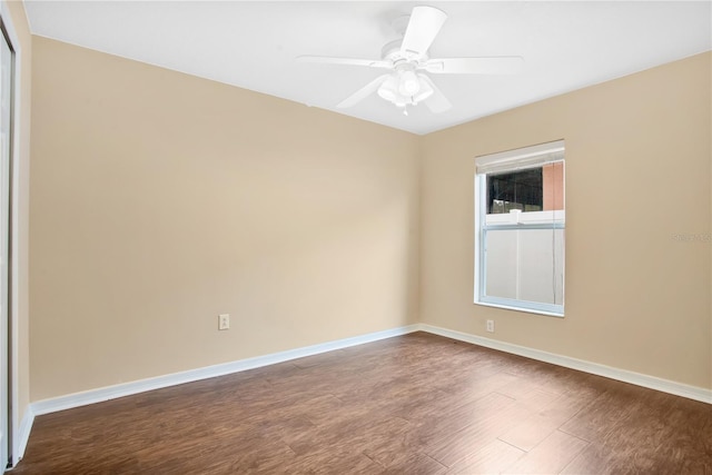 empty room with ceiling fan and wood-type flooring