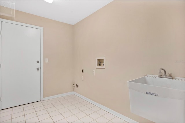 clothes washing area featuring hookup for a washing machine, sink, light tile patterned floors, and electric dryer hookup