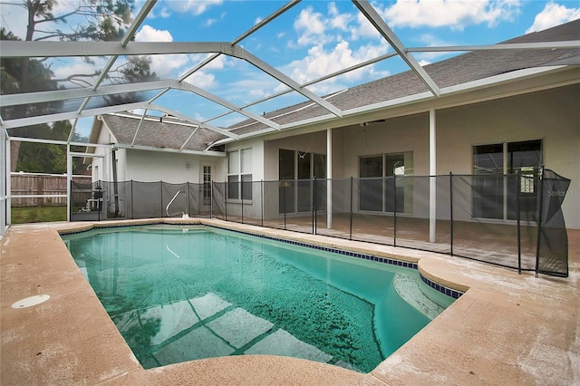 view of pool featuring a patio area and glass enclosure