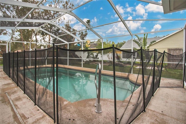 view of swimming pool with a patio and glass enclosure