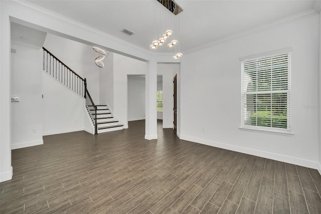 unfurnished living room with ornamental molding, a chandelier, and dark hardwood / wood-style flooring