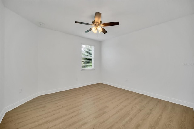 empty room featuring light wood-type flooring and ceiling fan