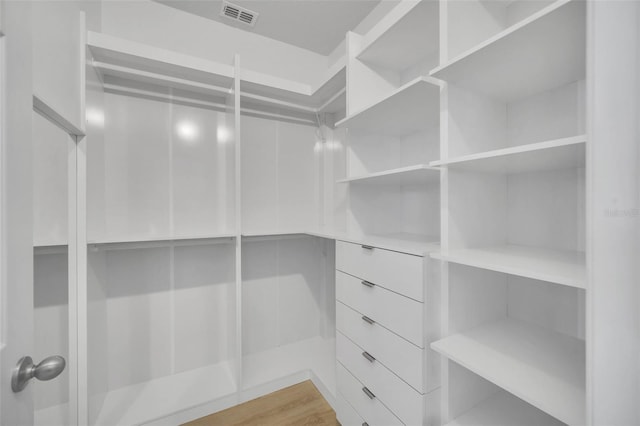 spacious closet featuring hardwood / wood-style flooring