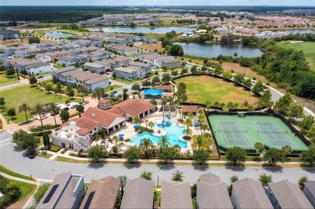 birds eye view of property with a water view