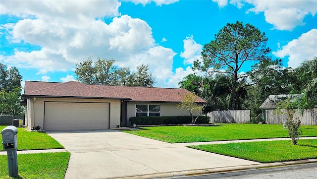 single story home with a front lawn and a garage