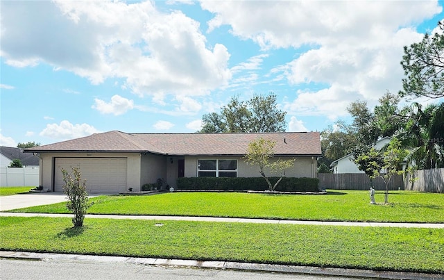 single story home featuring a front yard and a garage