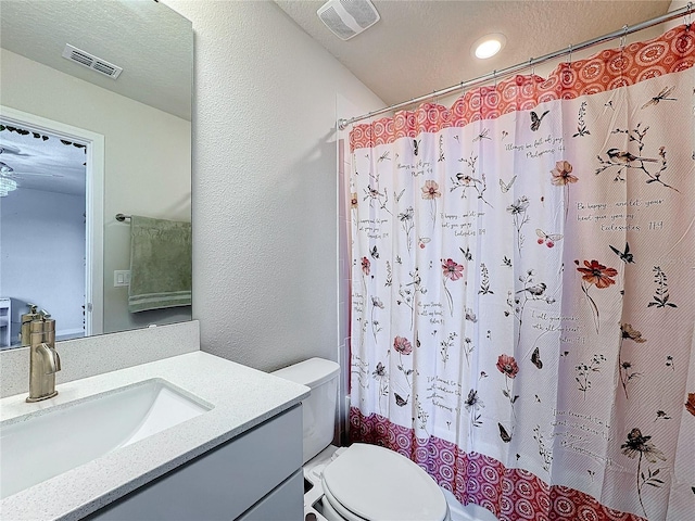 bathroom with vanity, toilet, and a shower with shower curtain