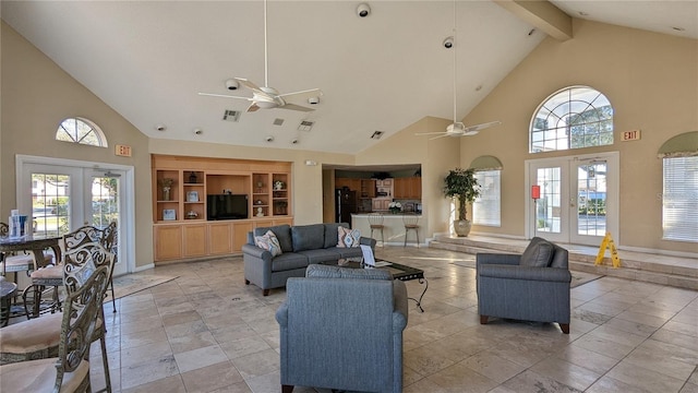 living room with french doors, ceiling fan, and high vaulted ceiling