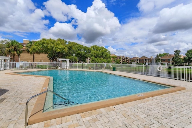 view of swimming pool featuring a patio area