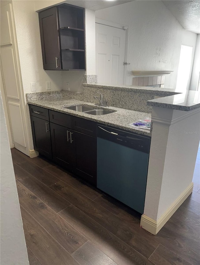 kitchen featuring dishwasher, light stone countertops, sink, and dark wood-type flooring