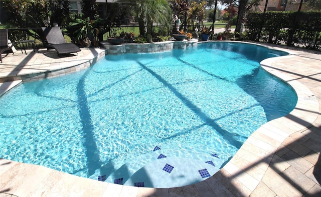 view of swimming pool featuring a patio