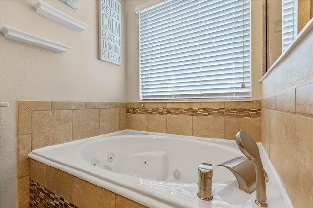 bathroom with tiled bath and a wealth of natural light