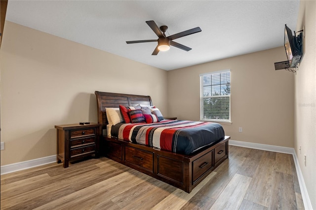 bedroom featuring light hardwood / wood-style floors and ceiling fan