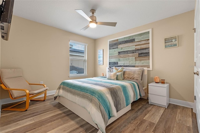 bedroom featuring light wood-type flooring and ceiling fan