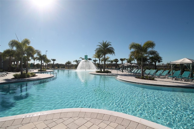 view of pool with a gazebo and pool water feature