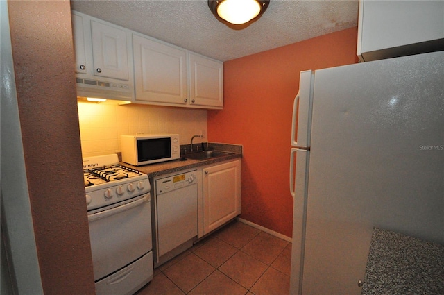 kitchen with a textured ceiling, sink, white cabinets, white appliances, and extractor fan