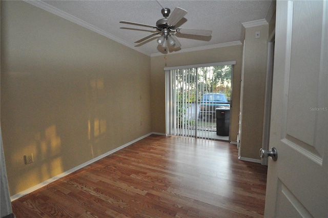 unfurnished room featuring a textured ceiling, ceiling fan, dark wood-type flooring, and crown molding