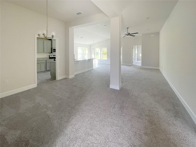 4298 Sagefield Dr, Harmony, FL 34773 - unfurnished living room featuring a chandelier, carpet flooring, a ceiling fan, and baseboards