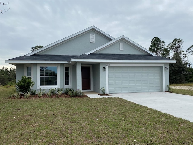 view of front facade featuring a front yard and a garage