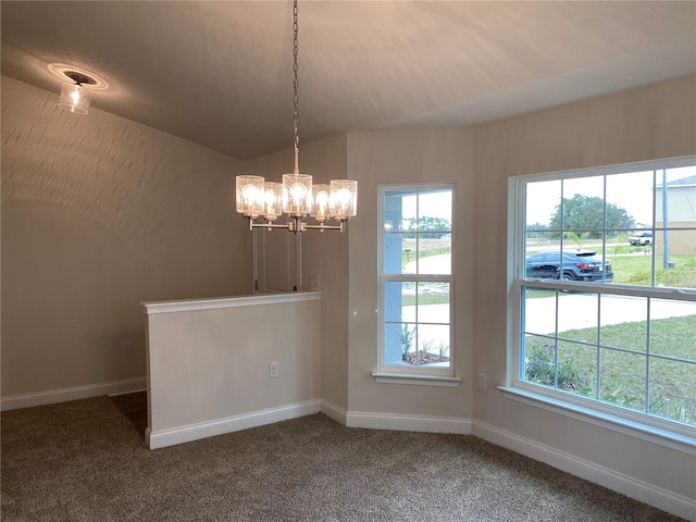 carpeted spare room featuring lofted ceiling and an inviting chandelier