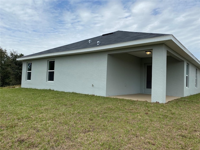 4306 Sagefield Dr, Harmony, FL 34773 - back of house with a patio, stucco siding, and a yard