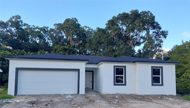 ranch-style house featuring a garage