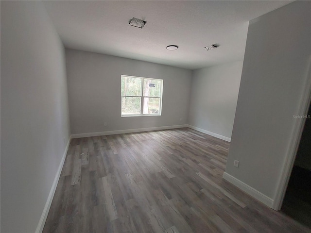 empty room featuring dark hardwood / wood-style floors