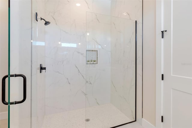 bathroom featuring an enclosed shower