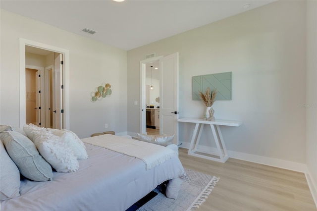 bedroom with light wood-type flooring