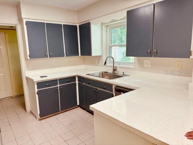 kitchen with sink and light tile patterned floors