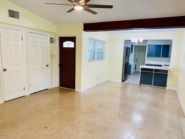 entryway featuring vaulted ceiling with beams and ceiling fan with notable chandelier