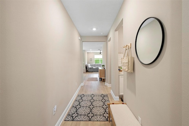 hallway with light wood-type flooring