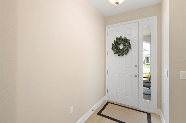 foyer entrance with light wood-type flooring