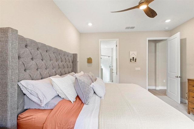 carpeted bedroom with ceiling fan and ensuite bathroom