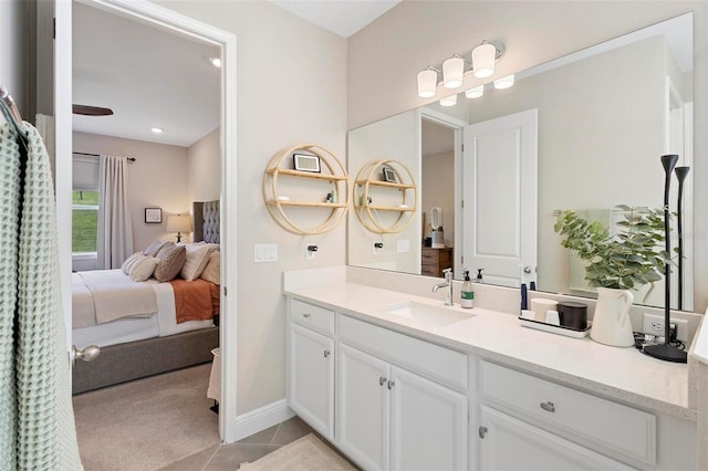 bathroom with tile patterned flooring and vanity