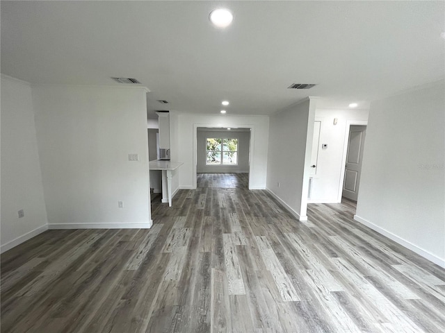 unfurnished living room with wood-type flooring