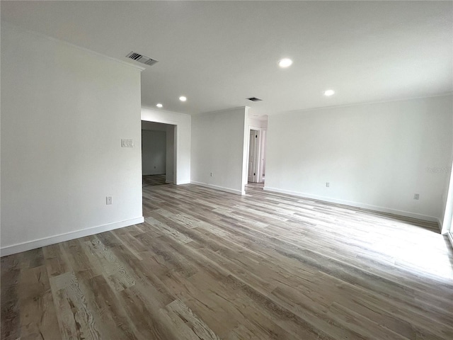 unfurnished living room featuring hardwood / wood-style floors