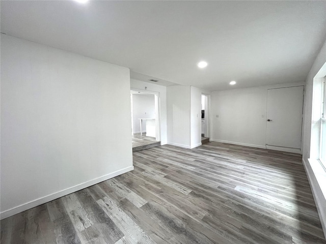 unfurnished living room with hardwood / wood-style flooring