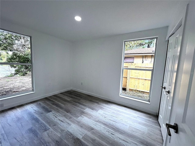 spare room featuring hardwood / wood-style flooring