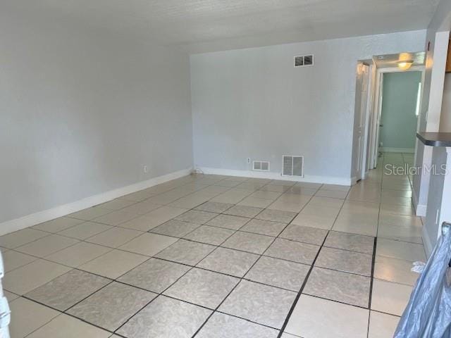 view of tiled spare room