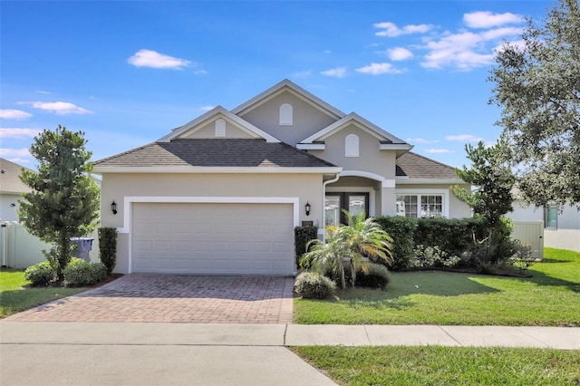 view of front of house featuring a garage and a front yard