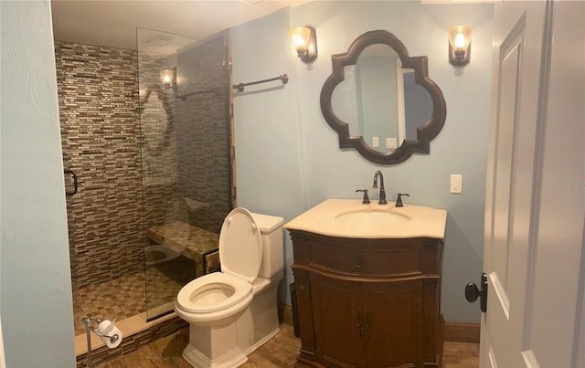 bathroom featuring wood-type flooring, vanity, toilet, and a shower with door