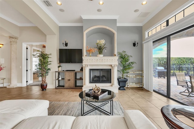 living room featuring light tile patterned flooring and ornamental molding