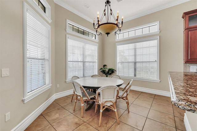 dining room featuring a chandelier, light tile patterned flooring, and crown molding