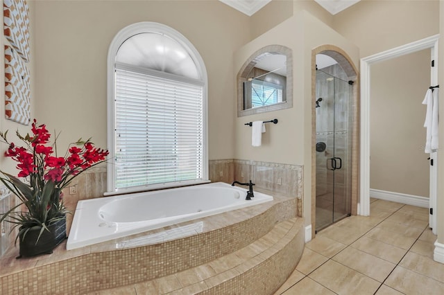 bathroom featuring independent shower and bath, tile patterned floors, and crown molding