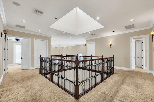 corridor with light carpet and ornamental molding